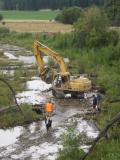 Re-building channel with excavator